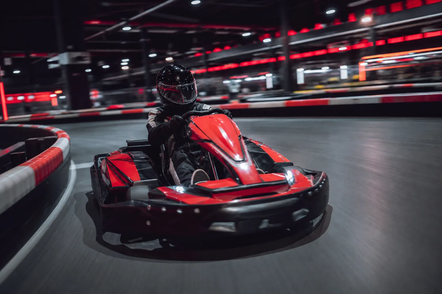 Apex Karting indoor go-kart racing at speed in Bushton, Kansas