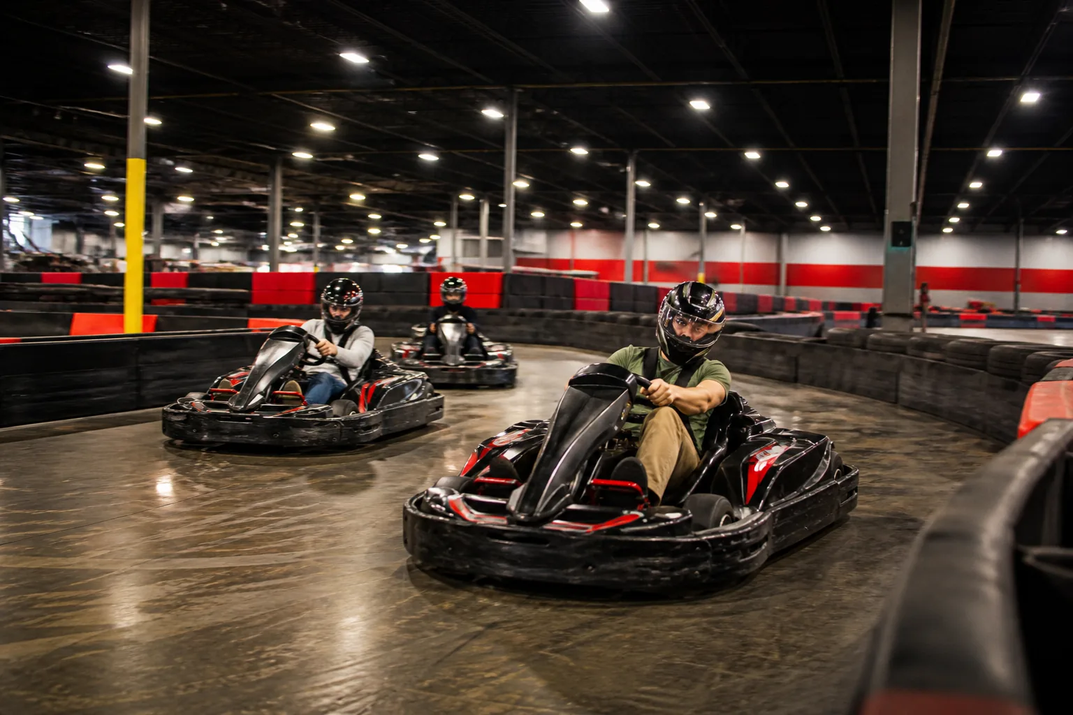 Friends racing indoor karts at Apex Karting in Bushton